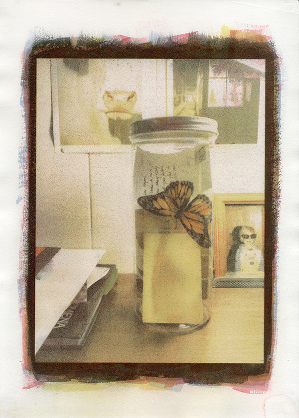 A jar of food with a butterfly on it.