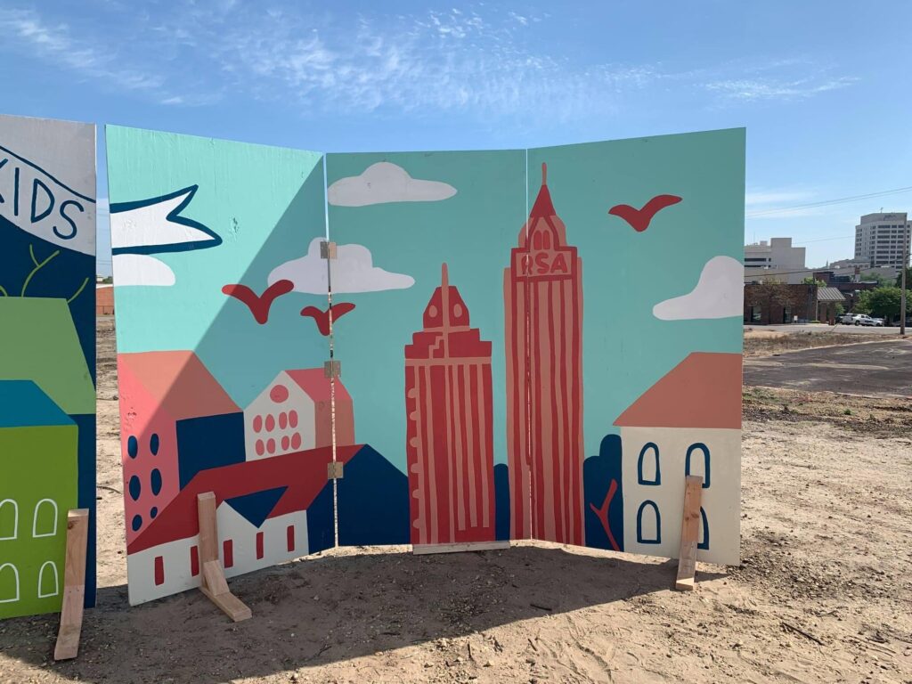 A picture of the city skyline painted on a wall.