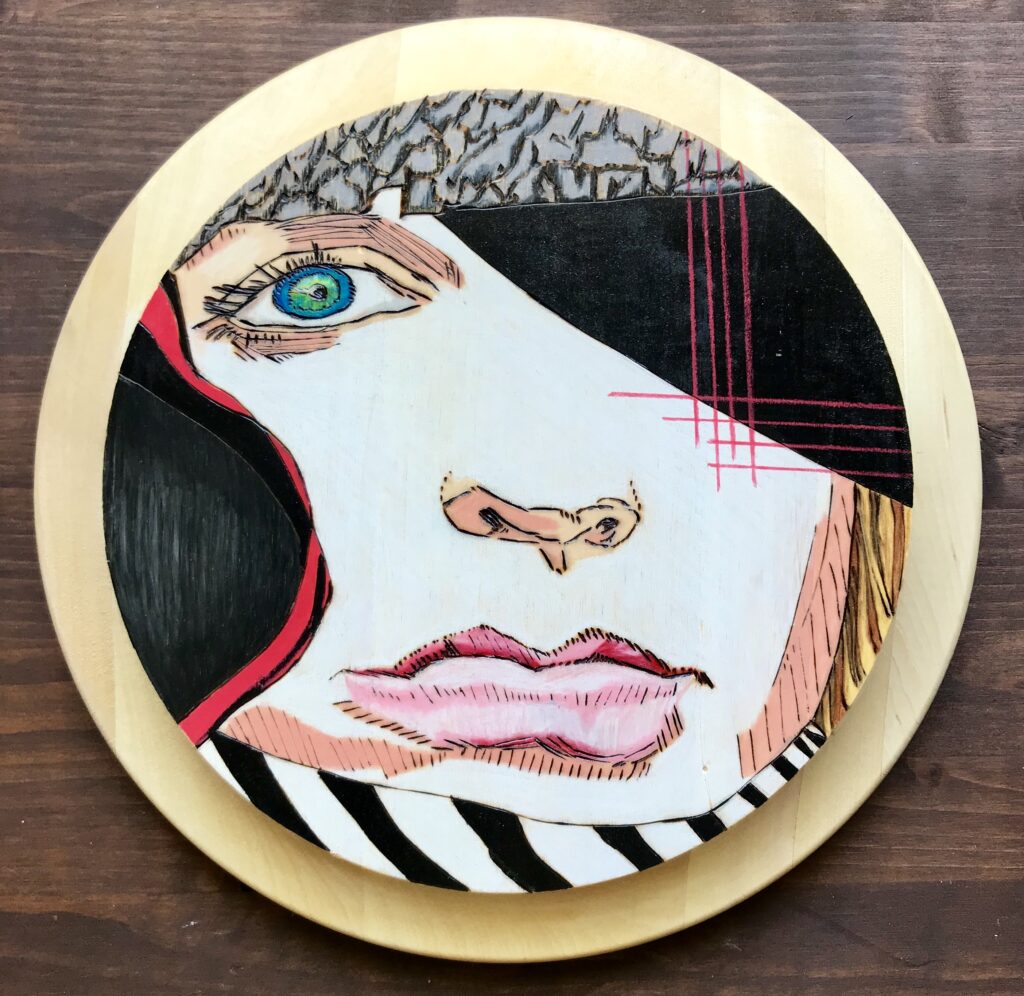 A plate with a woman 's face on it.