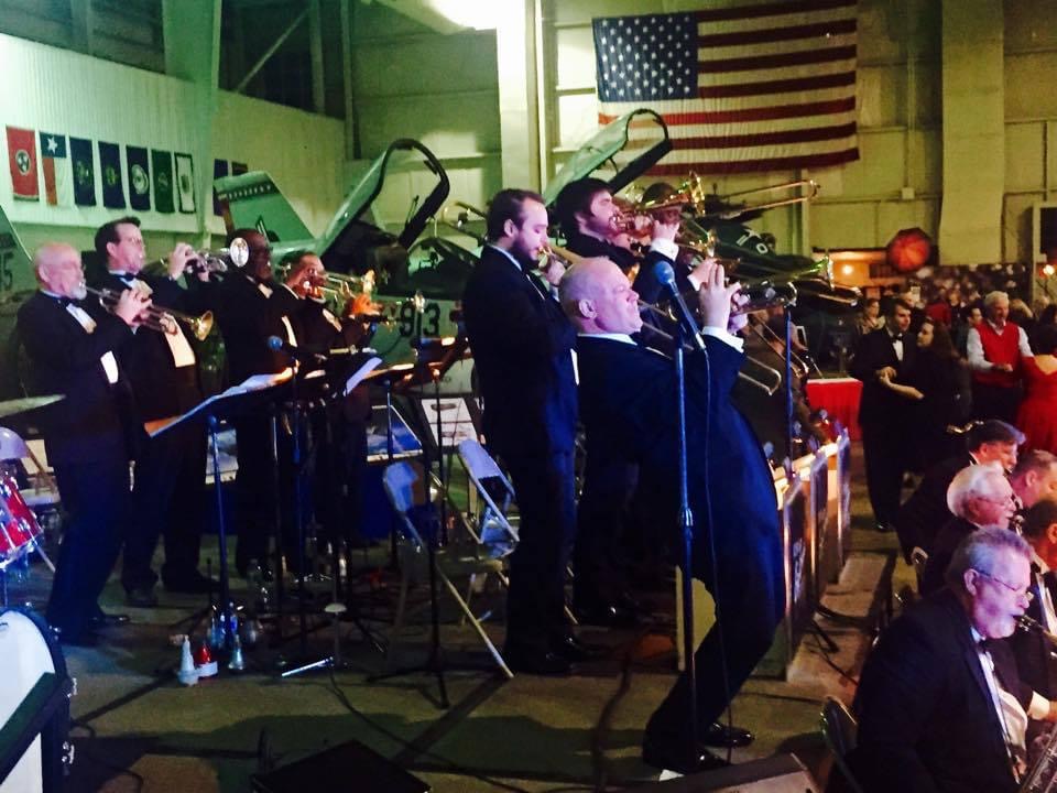 A group of people in suits and ties performing.