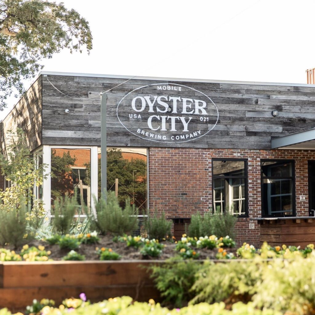 A brick building with a sign that says " oyster city ".