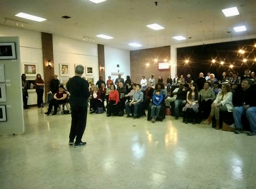 A man standing in front of a crowd of people.