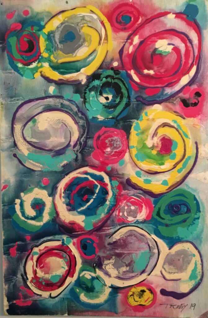 A painting of colorful circles and swirls