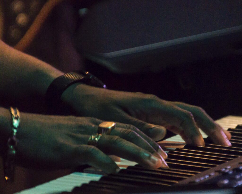 A person playing the piano with their hands