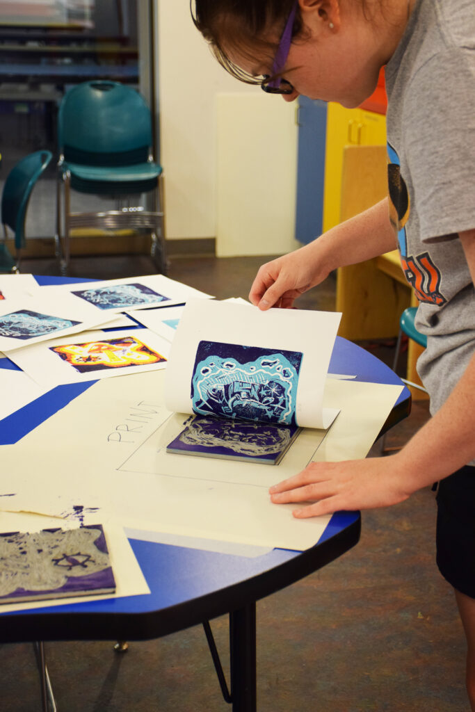 A person is working on an art project.