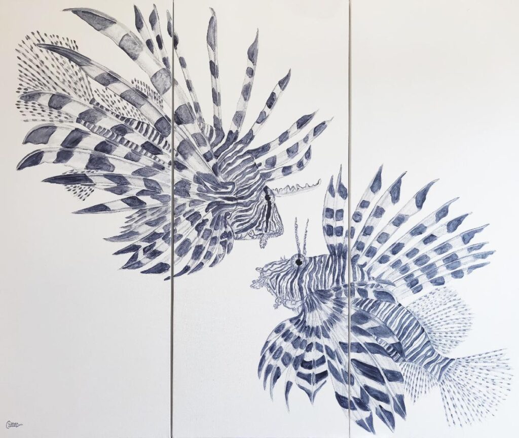 A drawing of two fish on poles with leaves.